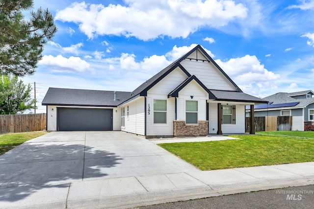 1295 NE Blossom, Mountain Home, ID 83647 - view of front of property featuring concrete driveway, an attached garage, and a shingled roof