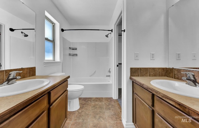 1295 NE Blossom, Mountain Home, ID 83647 - full bathroom featuring shower / tub combination, two vanities, and toilet