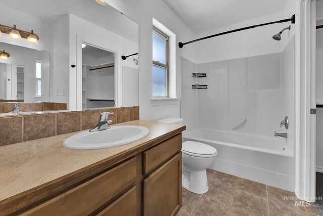 1295 NE Blossom, Mountain Home, ID 83647 - full bathroom featuring shower / bath combination, toilet, and vanity