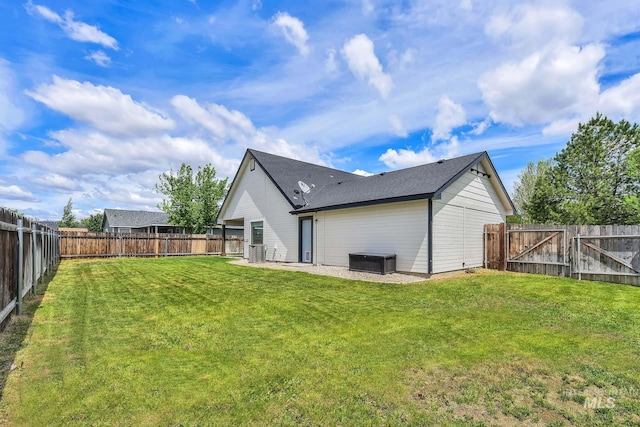 1295 NE Blossom, Mountain Home, ID 83647 - back of house with a gate and a patio area