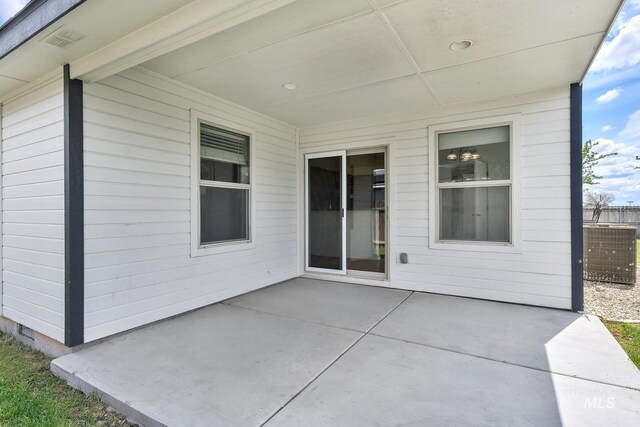 1295 NE Blossom, Mountain Home, ID 83647 - view of patio / terrace featuring fence and cooling unit