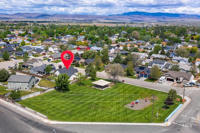 1295 NE Blossom, Mountain Home, ID 83647 - aerial view of residential area with a mountainous background