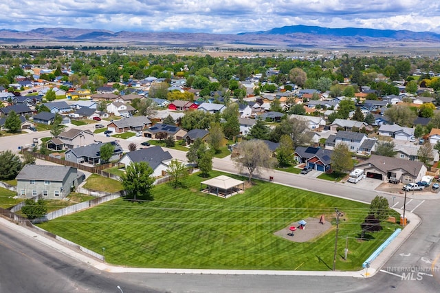 1295 NE Blossom, Mountain Home, ID 83647 - aerial perspective of suburban area featuring a mountainous background