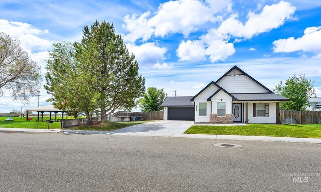 1295 NE Blossom, Mountain Home, ID 83647 - view of front facade with concrete driveway, an attached garage, and a gazebo