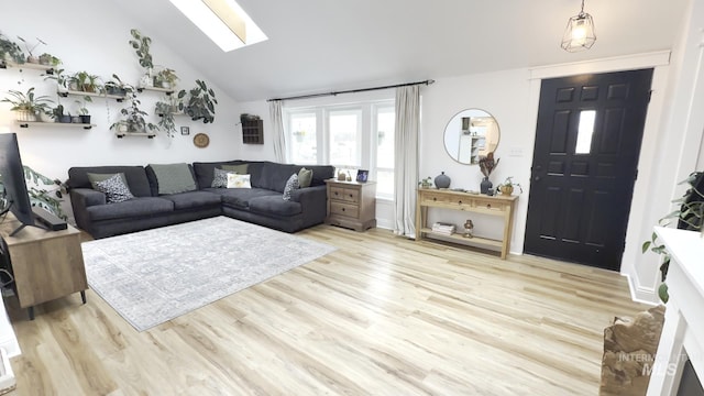 7985 S Cloverdale Rd, Boise, ID 83709 - living room with wood finished floors and lofted ceiling with skylight