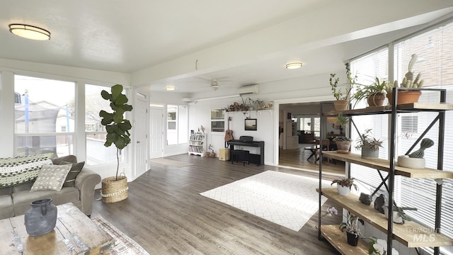 7985 S Cloverdale Rd, Boise, ID 83709 - living area with an AC wall unit, a ceiling fan, and wood finished floors