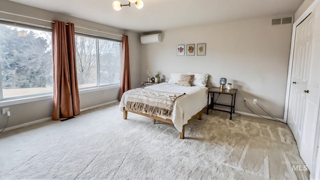 7985 S Cloverdale Rd, Boise, ID 83709 - bedroom with visible vents, an AC wall unit, a closet, baseboards, and carpet flooring