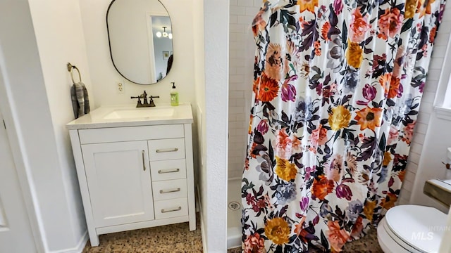 7985 S Cloverdale Rd, Boise, ID 83709 - full bathroom with speckled floor, toilet, vanity, and a shower with shower curtain