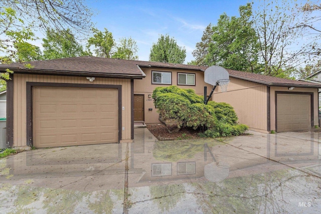 view of front of house with an attached garage and driveway