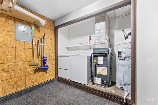 utility room with washing machine and dryer and electric panel