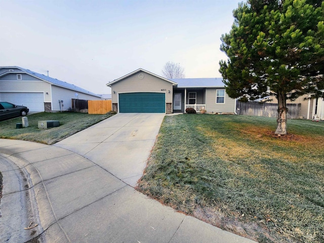 single story home with a front yard and a garage