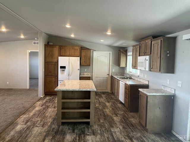 kitchen featuring open shelves, white appliances, dark wood-type flooring, a center island, and a sink