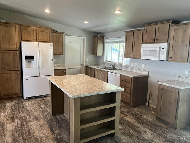 kitchen featuring open shelves, a kitchen island, white appliances, dark wood-style floors, and a sink