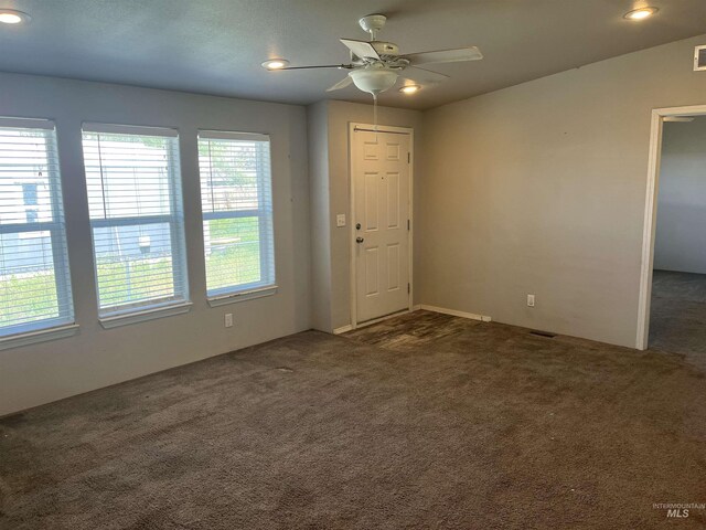 empty room featuring recessed lighting, ceiling fan, visible vents, and carpet