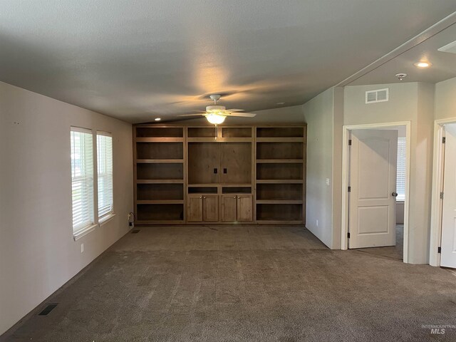 unfurnished living room featuring carpet flooring, a ceiling fan, visible vents, and recessed lighting