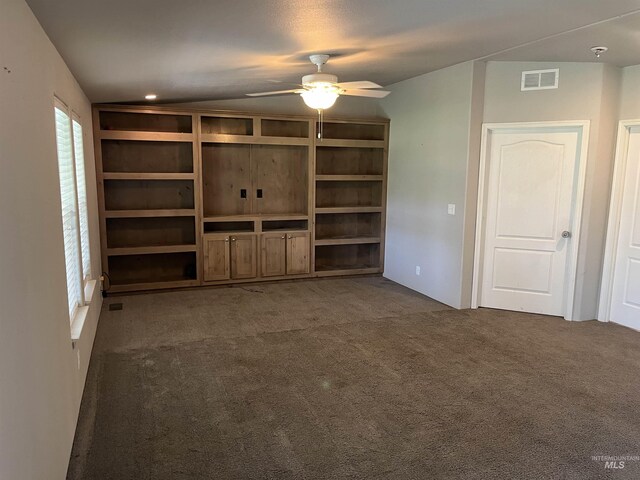 unfurnished living room with a ceiling fan, carpet flooring, and visible vents
