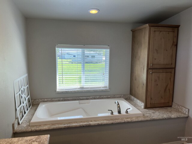 bathroom featuring a garden tub