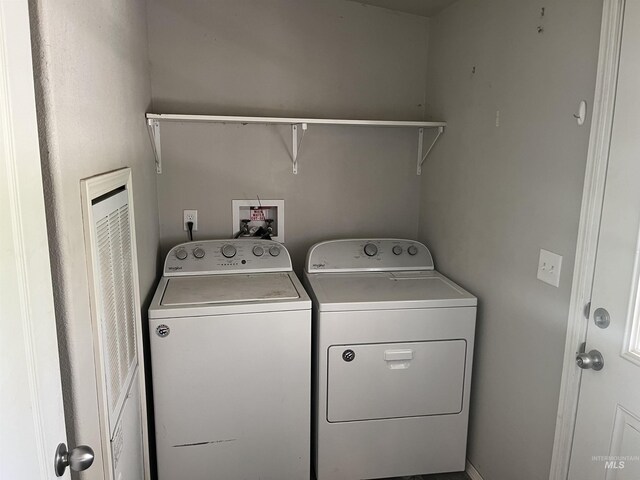 laundry area featuring independent washer and dryer and laundry area