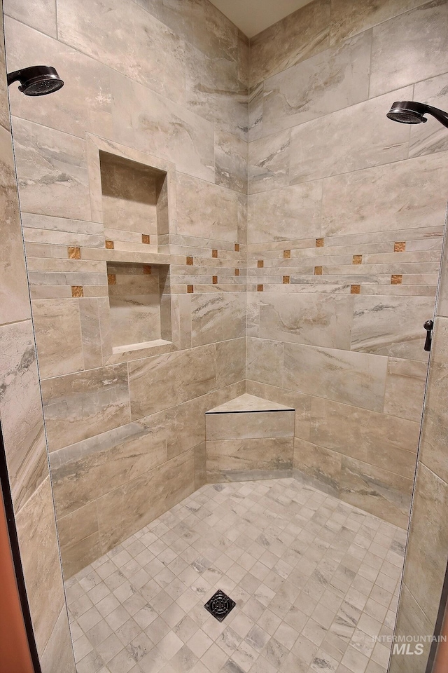 bathroom with tiled shower