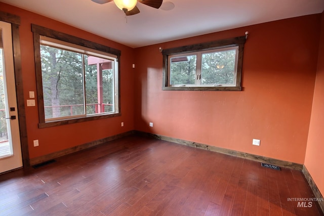 spare room with hardwood / wood-style flooring and ceiling fan