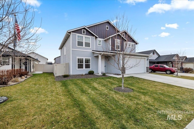 view of front of property featuring a front lawn and a garage