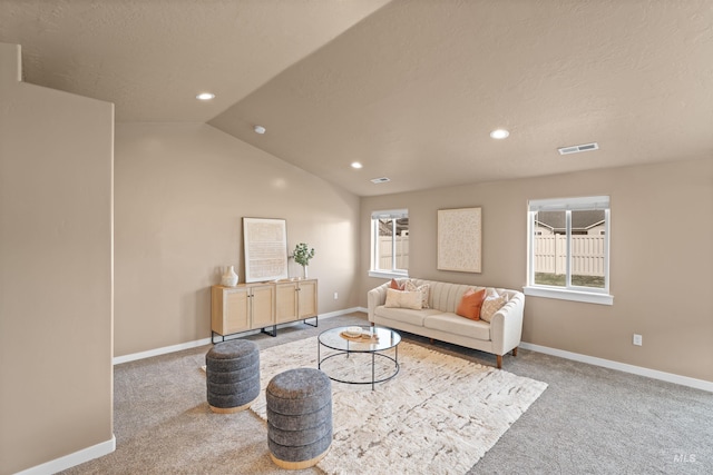 6296 W Mattawa Dr, Meridian, ID 83646 - carpeted living area featuring plenty of natural light, visible vents, baseboards, and lofted ceiling
