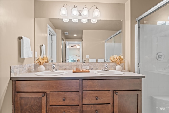 6296 W Mattawa Dr, Meridian, ID 83646 - bathroom featuring double vanity, a sink, a stall shower, and ceiling fan
