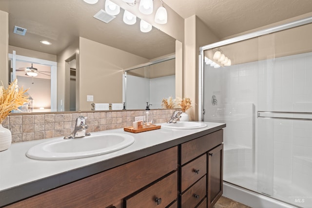 6296 W Mattawa Dr, Meridian, ID 83646 - bathroom with visible vents, a sink, and a stall shower
