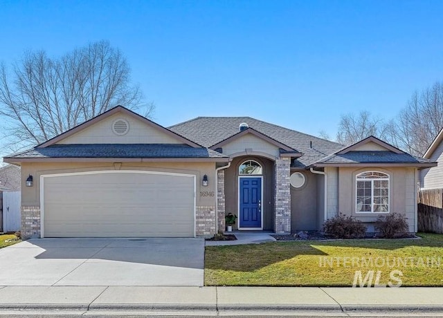 ranch-style house featuring a garage, driveway, a front lawn, and fence