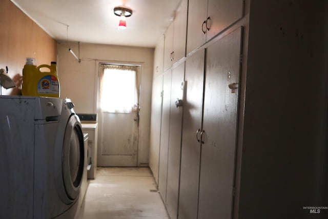 laundry area featuring cabinet space and separate washer and dryer