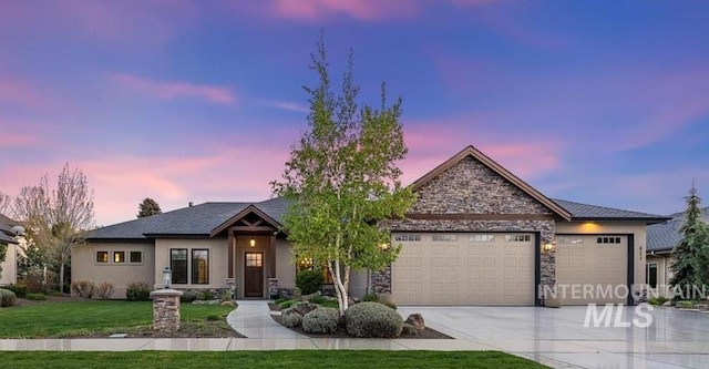 421 E Fishing Creek Ln, Eagle, ID 83616 - view of front of property with stone siding, an attached garage, driveway, a front yard, and stucco siding