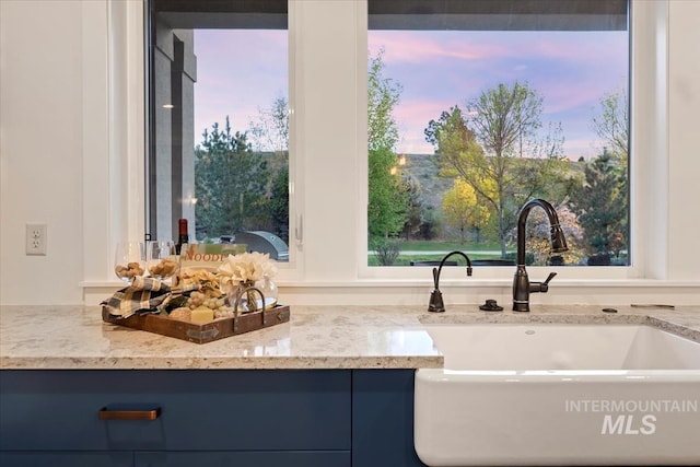 421 E Fishing Creek Ln, Eagle, ID 83616 - kitchen view of a sink and light stone countertops