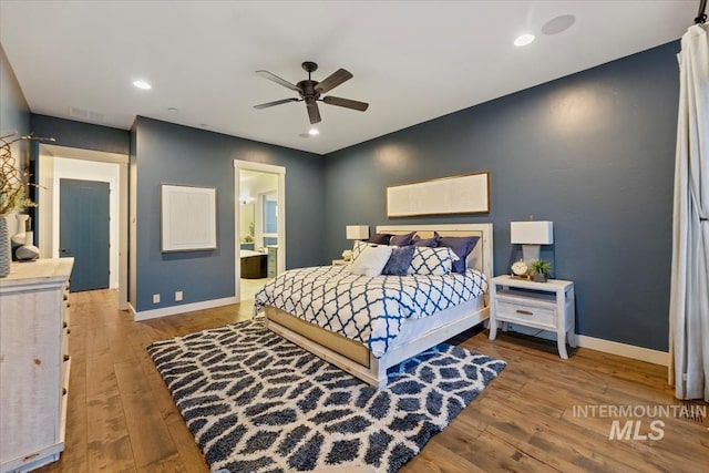 421 E Fishing Creek Ln, Eagle, ID 83616 - bedroom with baseboards, wood finished floors, ensuite bath, and recessed lighting
