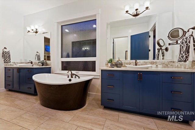 421 E Fishing Creek Ln, Eagle, ID 83616 - bathroom featuring a freestanding bath and two vanities