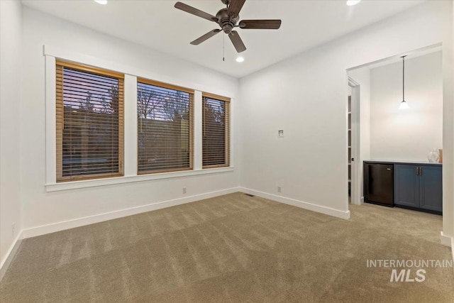 421 E Fishing Creek Ln, Eagle, ID 83616 - carpeted empty room with baseboards, a ceiling fan, recessed lighting, and bar