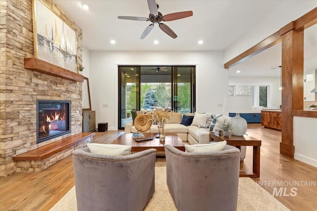 421 E Fishing Creek Ln, Eagle, ID 83616 - living area with light wood-style flooring, a fireplace, a ceiling fan, and recessed lighting
