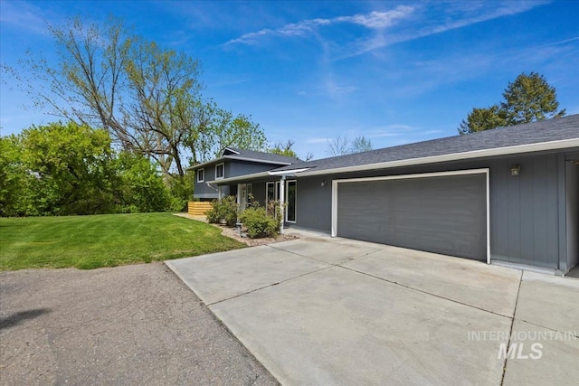 13343 N Horseshoe Bend Rd, Boise, ID 83714 - split level home featuring a garage, driveway, a front yard, and a shingled roof