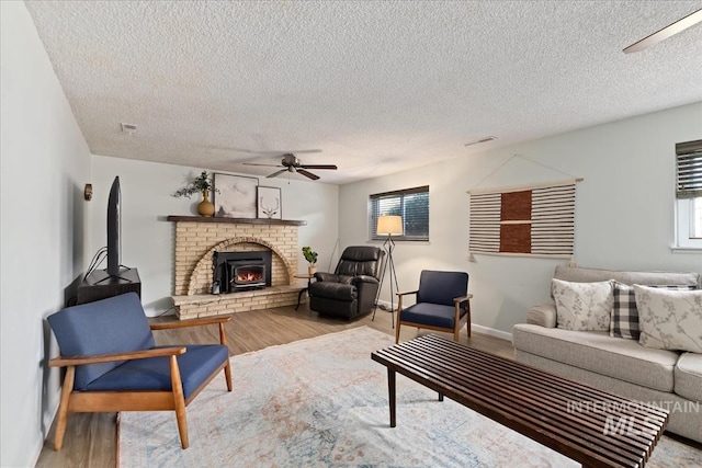13343 N Horseshoe Bend Rd, Boise, ID 83714 - living room with ceiling fan, wood finished floors, a textured ceiling, and baseboards