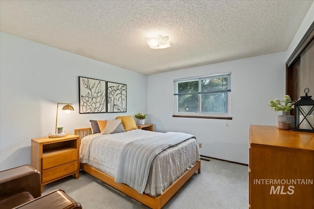 13343 N Horseshoe Bend Rd, Boise, ID 83714 - bedroom with light colored carpet, a textured ceiling, and baseboards