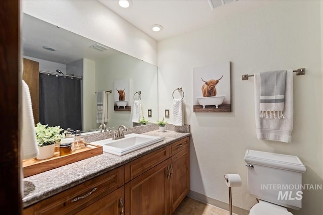 13343 N Horseshoe Bend Rd, Boise, ID 83714 - full bath with vanity, toilet, baseboards, and curtained shower