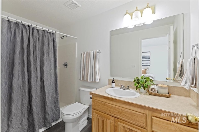 13343 N Horseshoe Bend Rd, Boise, ID 83714 - bathroom featuring vanity, toilet, and curtained shower