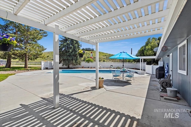 13343 N Horseshoe Bend Rd, Boise, ID 83714 - fenced backyard featuring a patio and a pergola