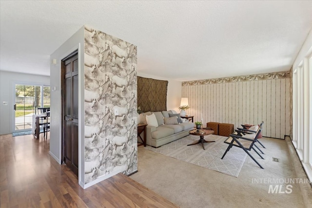 13343 N Horseshoe Bend Rd, Boise, ID 83714 - living area featuring wood finished floors and wallpapered walls