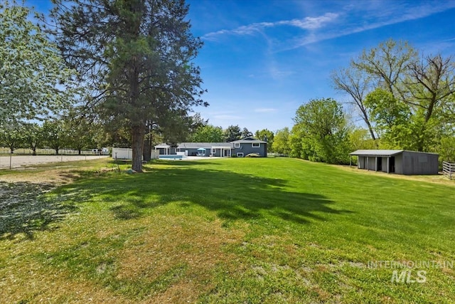 13343 N Horseshoe Bend Rd, Boise, ID 83714 - view of green lawn with an outbuilding and a pole building