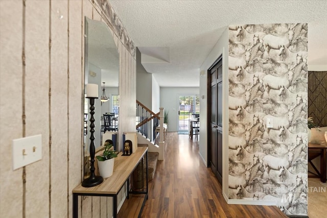 13343 N Horseshoe Bend Rd, Boise, ID 83714 - corridor featuring dark wood-style floors, a textured ceiling, and stairway