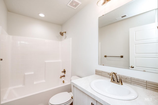 bathroom with vanity,  shower combination, toilet, and visible vents