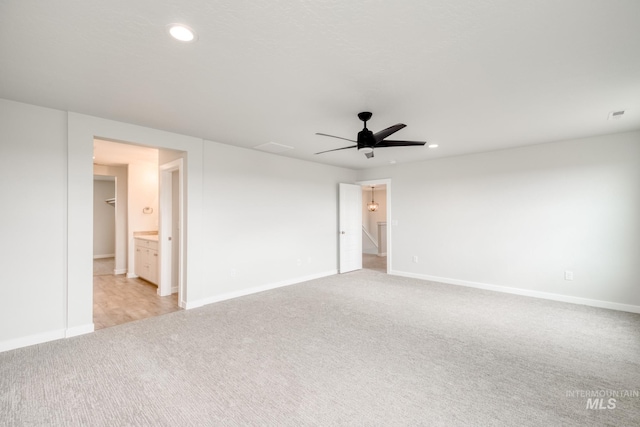 empty room with visible vents, baseboards, carpet floors, recessed lighting, and ceiling fan