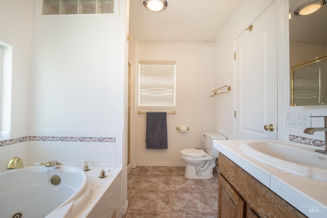 bathroom featuring baseboards, toilet, a garden tub, tile patterned flooring, and vanity