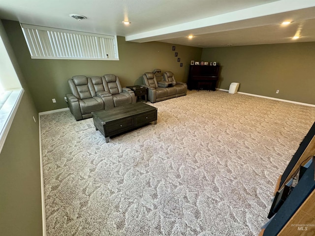 living room with baseboards, visible vents, and carpet flooring