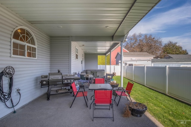 view of patio with outdoor dining area and a fenced backyard